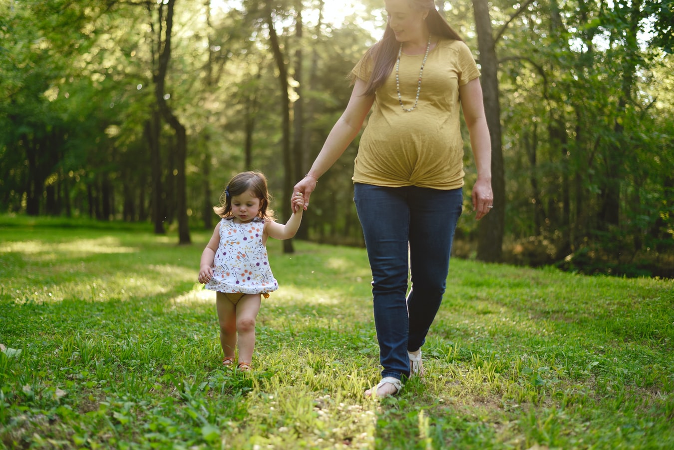 Woman in Maternity Jeans with a baby girl